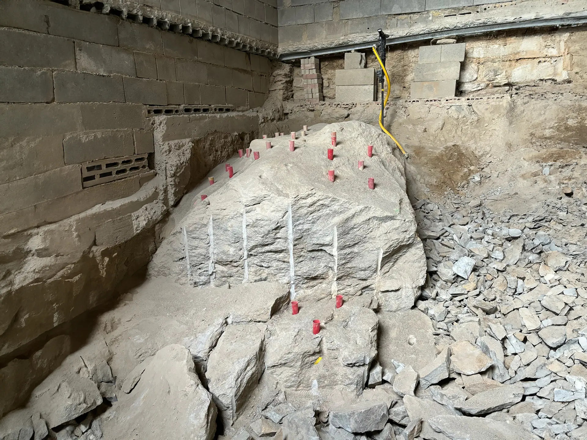 Rock removal inside a basement without blasting or hammering